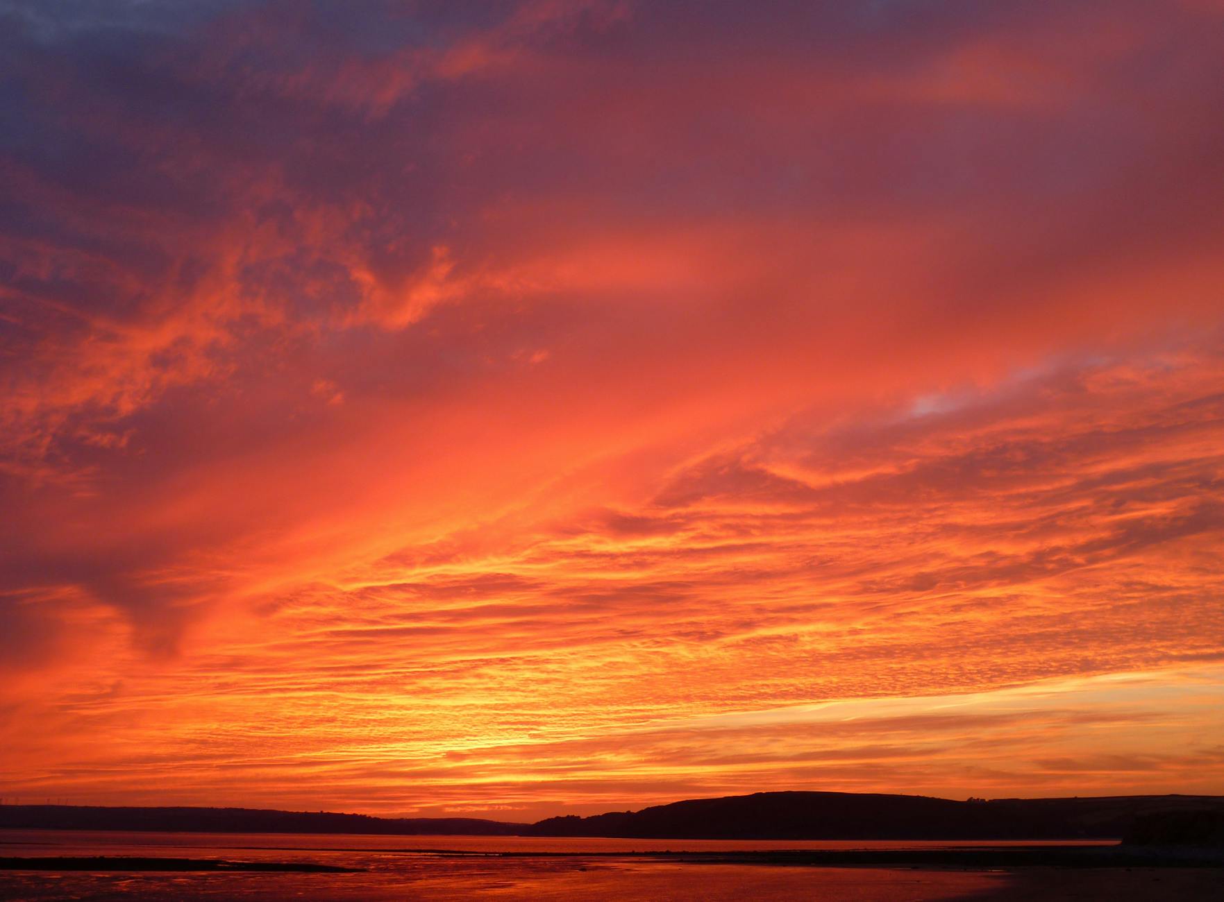 mountains under red skies